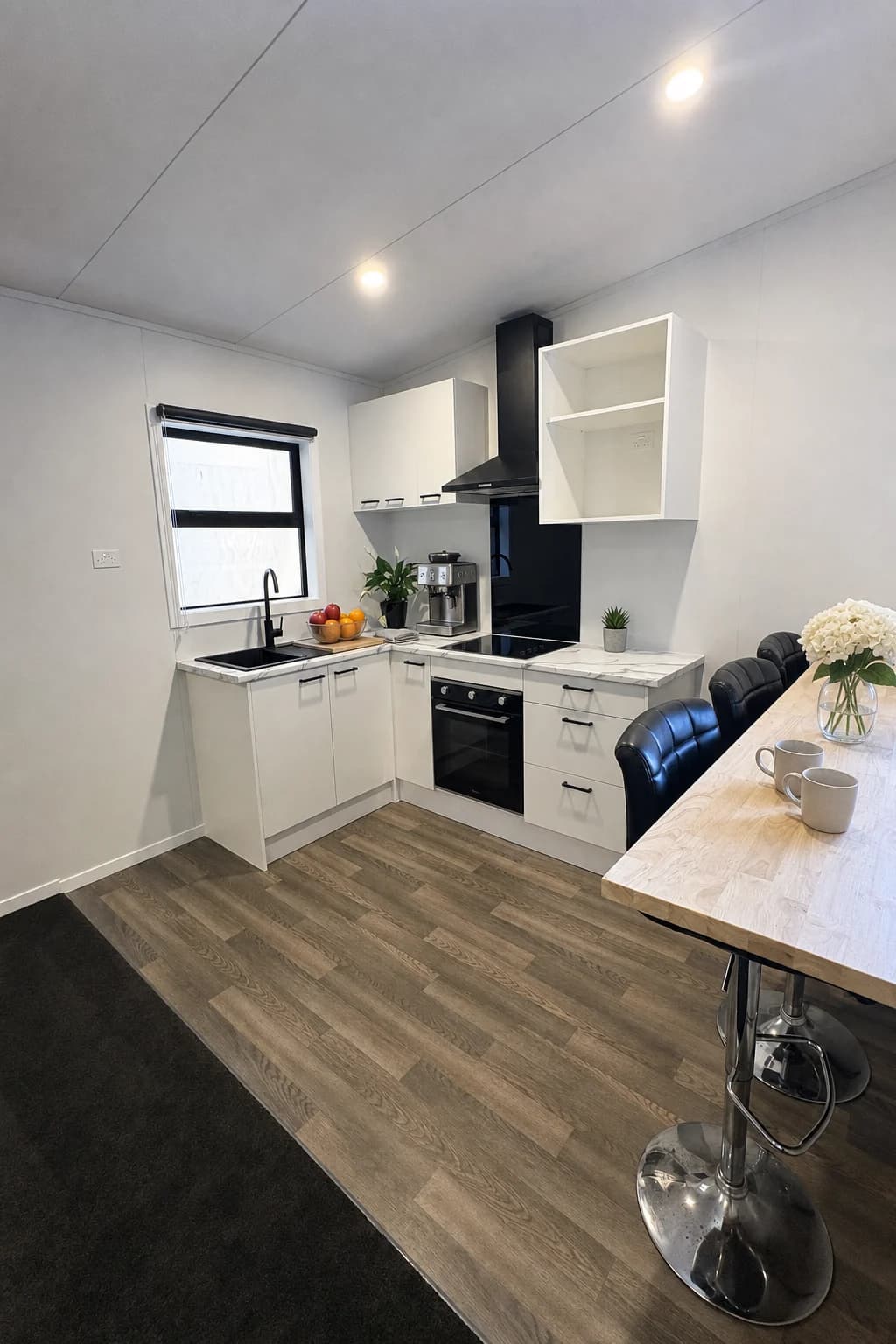 Tiny home interior render with kitchen and living area