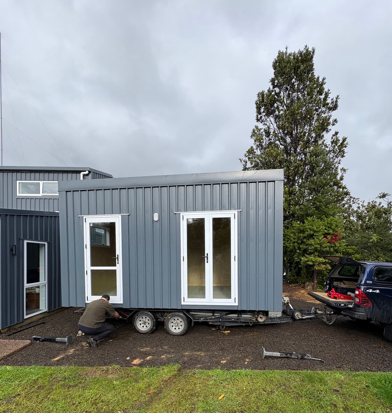 NZ-made transportable cabin sited in a residential backyard