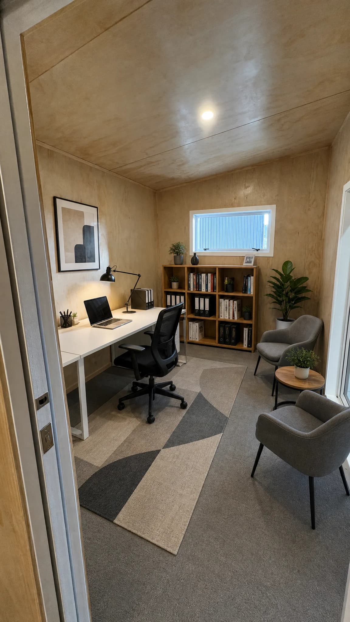 Sleepout interior with bed and storage joinery