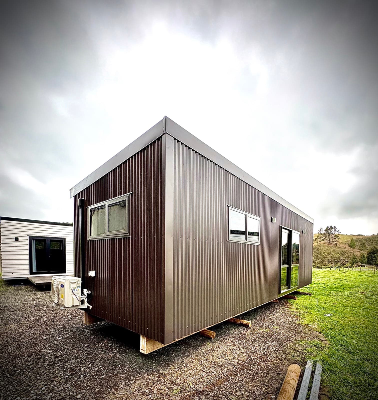Smart Housing Solutions Te Awamutu build - Custom-built 9×3 NZ-made tiny home with heat pump installed on a customer site
